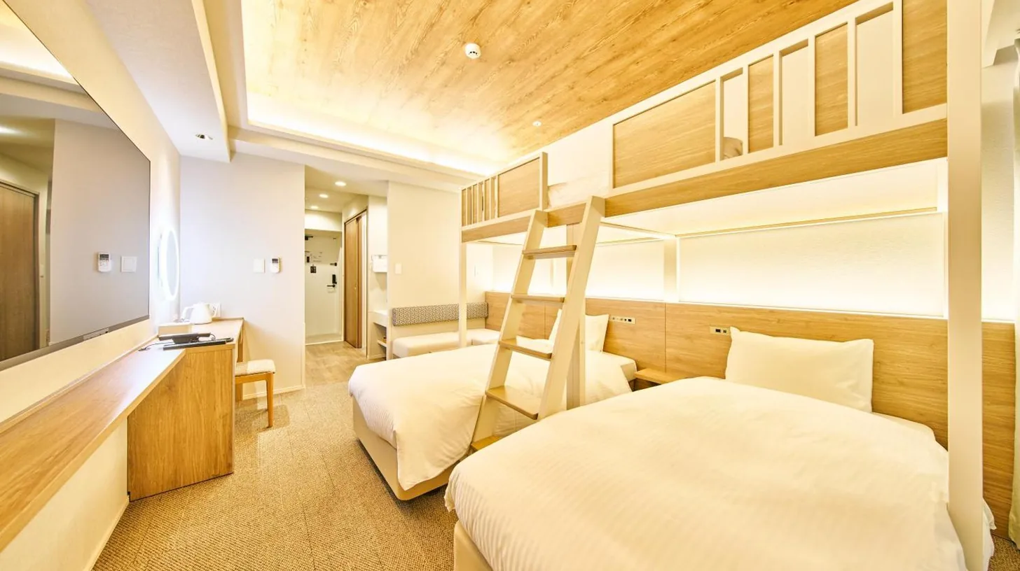 a bedroom with two beds and a loft bed at 2026年7月New Open! Grand STAY Hakata Nishinakasu in Fukuoka