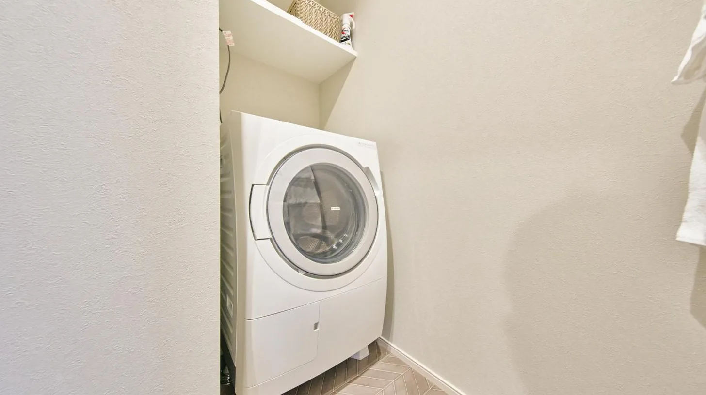 a white refrigerator in a room with a bed at 2026年7月New Open! Grand STAY Hakata Nishinakasu in Fukuoka