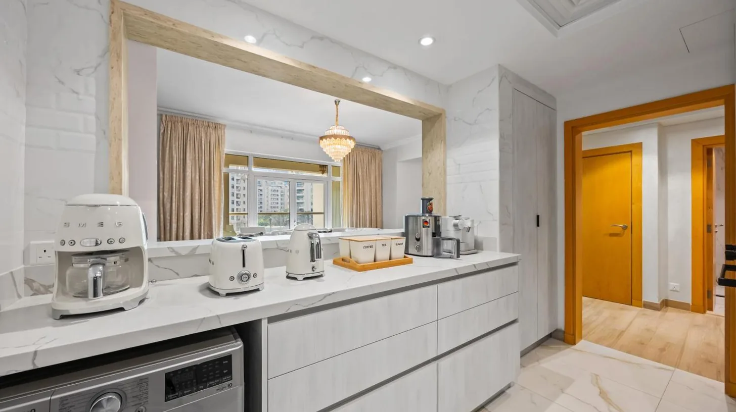 a kitchen with a counter top with appliances on it at 2BDR Luxury Apartment in Palm in Dubai