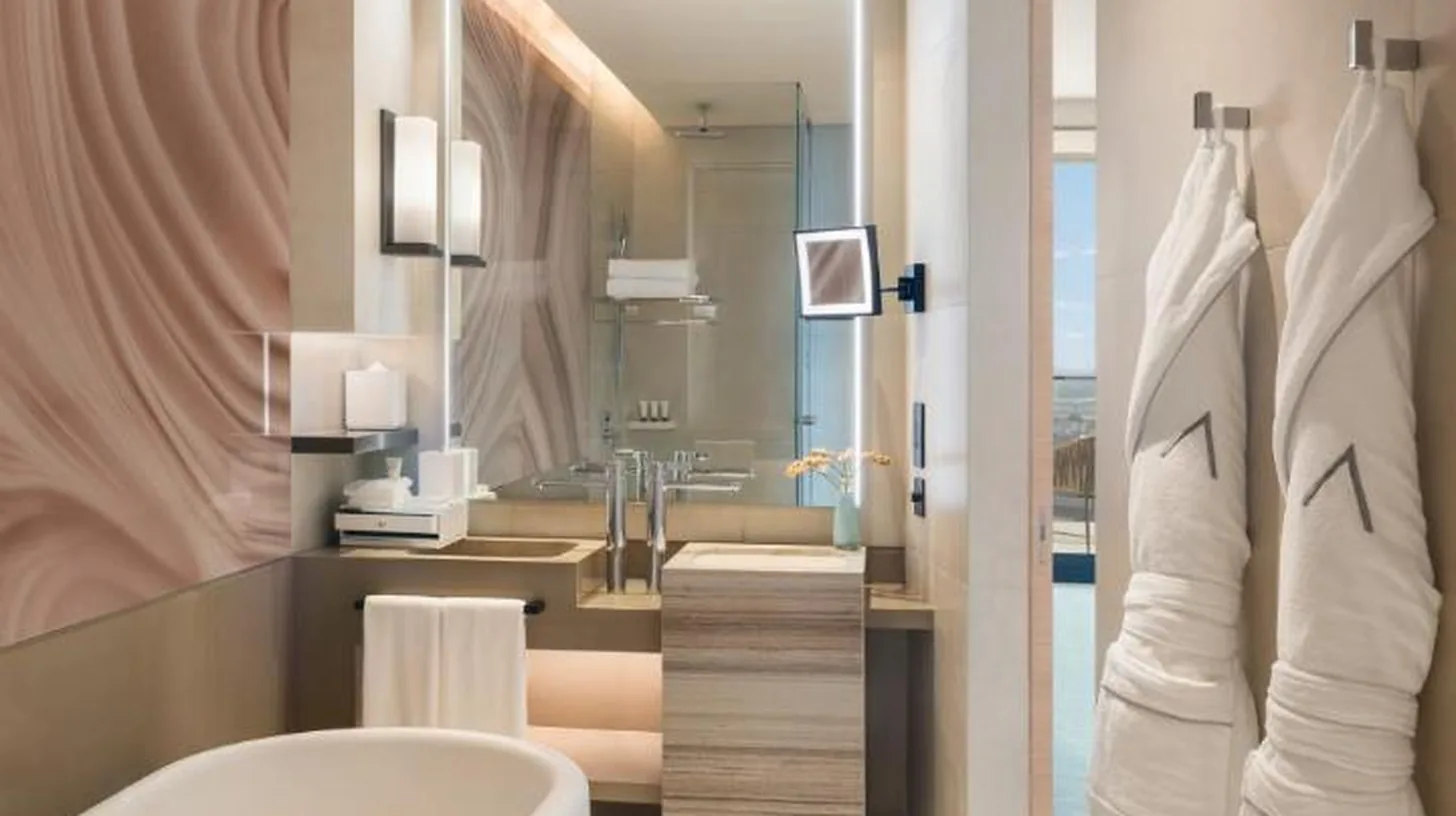 a bathroom with a white tub and a sink at Address Beach Resort in Dubai
