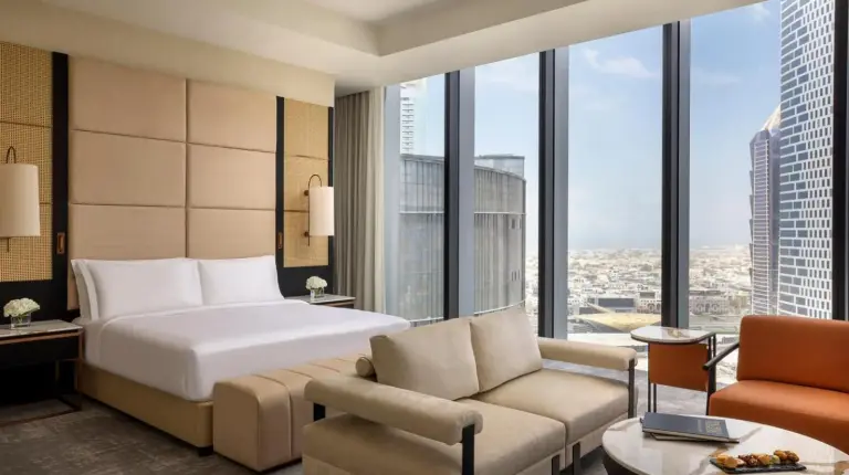 a hotel room with a bed and a large window at Anantara Downtown Dubai in Dubai
