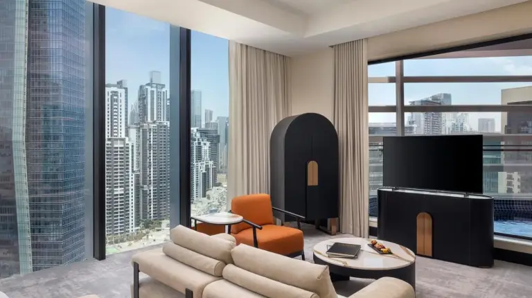 a living room with a view of a city at Anantara Downtown Dubai in Dubai