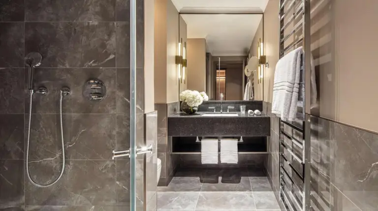 a bathroom with a shower and a sink at Anantara Plaza Nice Hotel - A Leading Hotel of the World in Nice