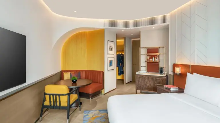 a bathroom with a tub and a shower and a sink at Andaz One Bangkok