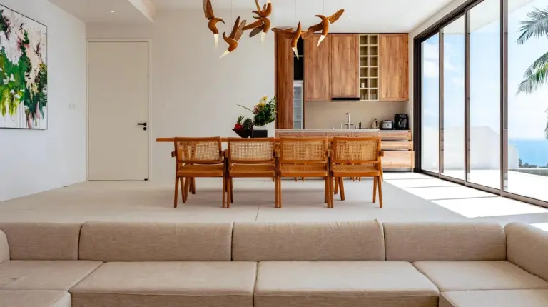 a living room with a couch and a table at Anzhu Seamate Villa Samui in Lamai