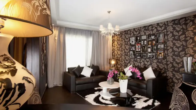 a living room with a couch and a table at Art Palace Suites & Spa in Casablanca