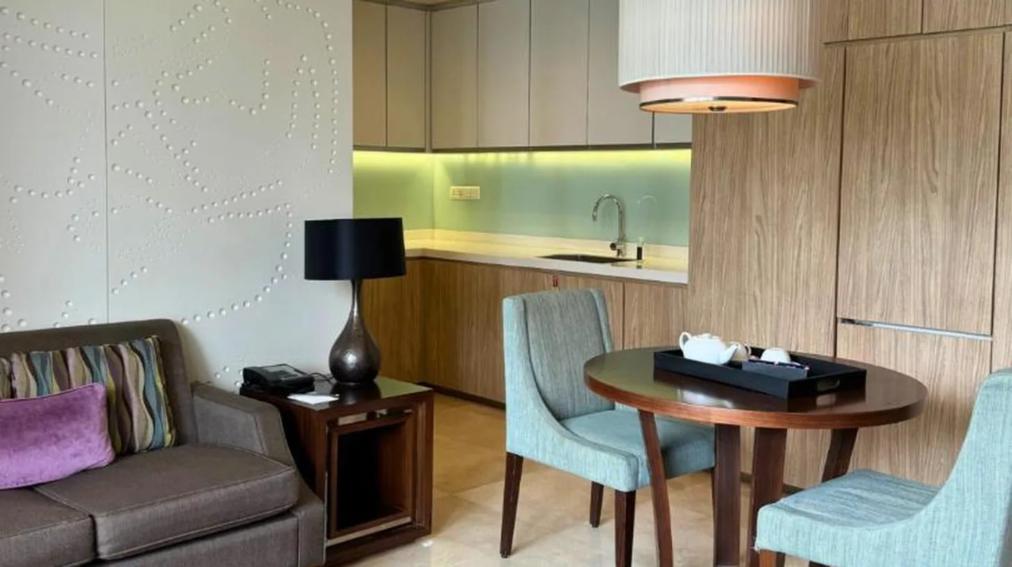 a bathroom with a bath tub and a shower at Ascott Kuningan Jakarta in Jakarta