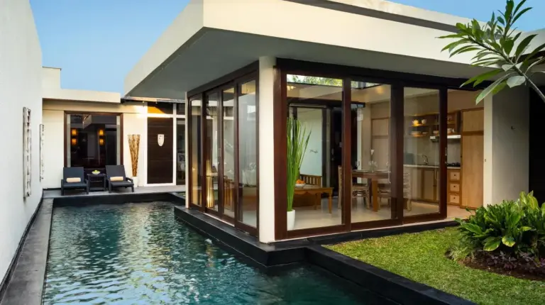 a bathroom with a tub and a sink at Avani Seminyak Bali Resort in Seminyak