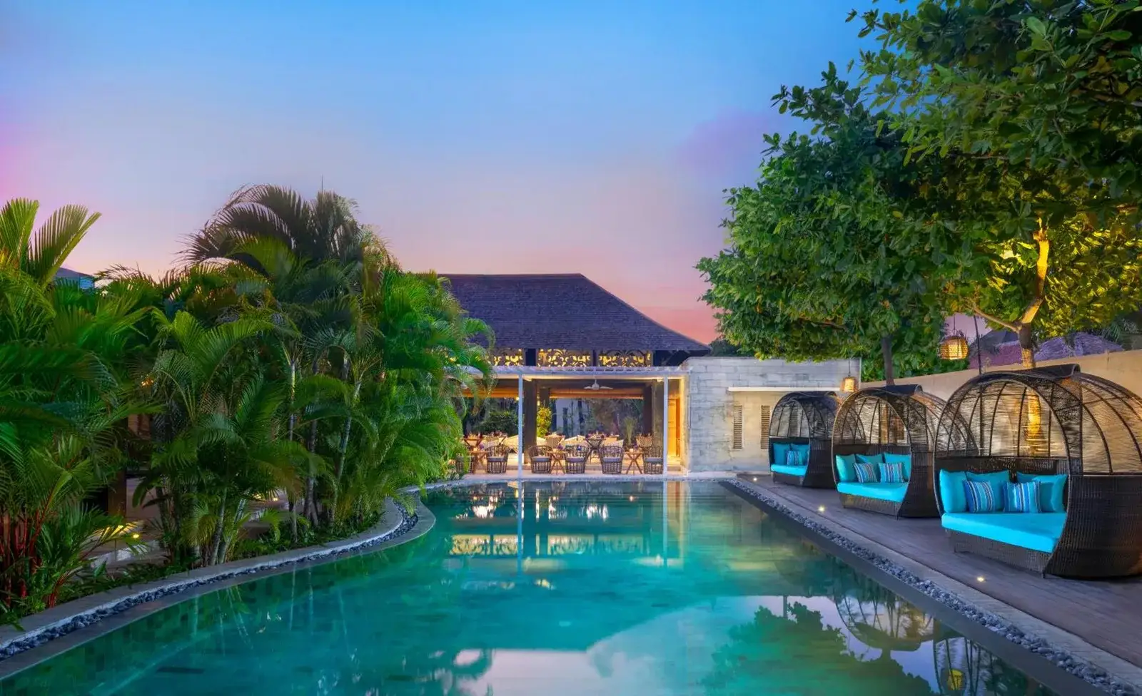 Avani Seminyak Bali Resort Pool Area with Lush Greenery