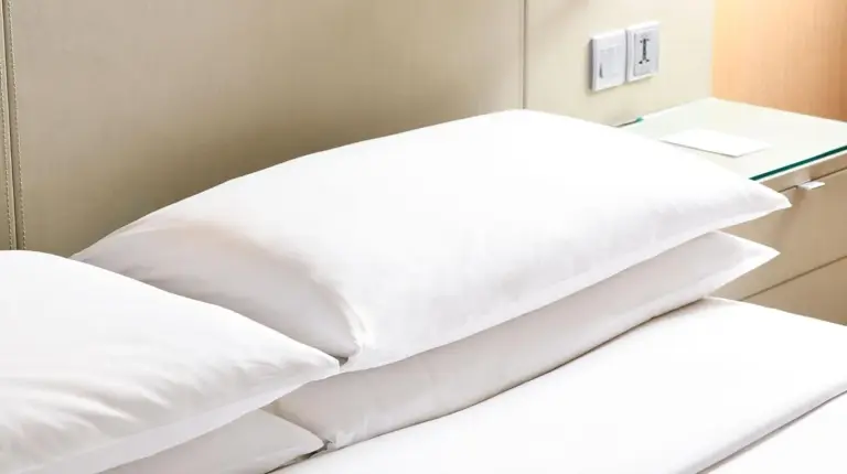 a bed in a hospital room with white pillows at Bangkok Marriott Hotel Sukhumvit in Bangkok