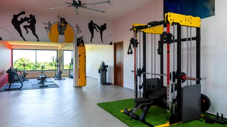 a room with a gym with a wall with a painting at BLUE ELEPHANT Luxury Pool Villa Koh Samui in Koh Samui