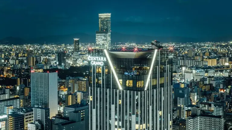 a view of a large city at night at Centara Grand Hotel Osaka in Osaka