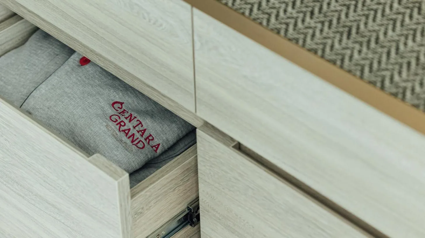 a drawer with a baseball glove inside of it at Centara Grand Hotel Osaka in Osaka