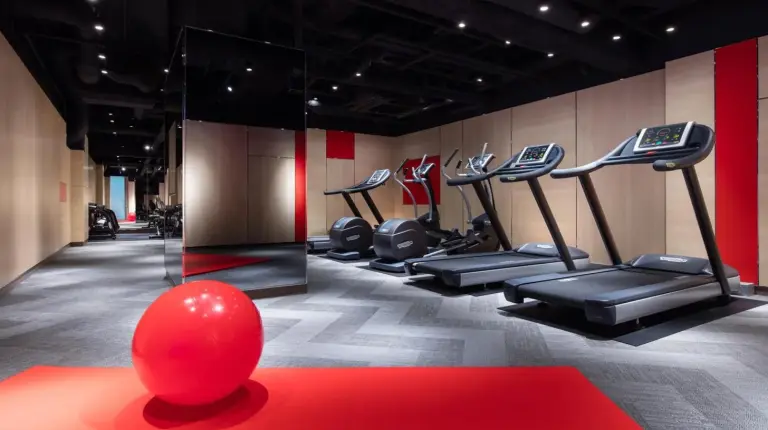 a gym with a red ball in the middle of a room at Courtyard by Marriott Shin-Osaka Station in Osaka