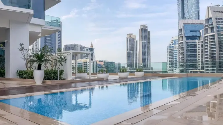 a swimming pool on the roof of a building at Deluxe Marina View 2BR - Stella Maris Retreat in Dubai
