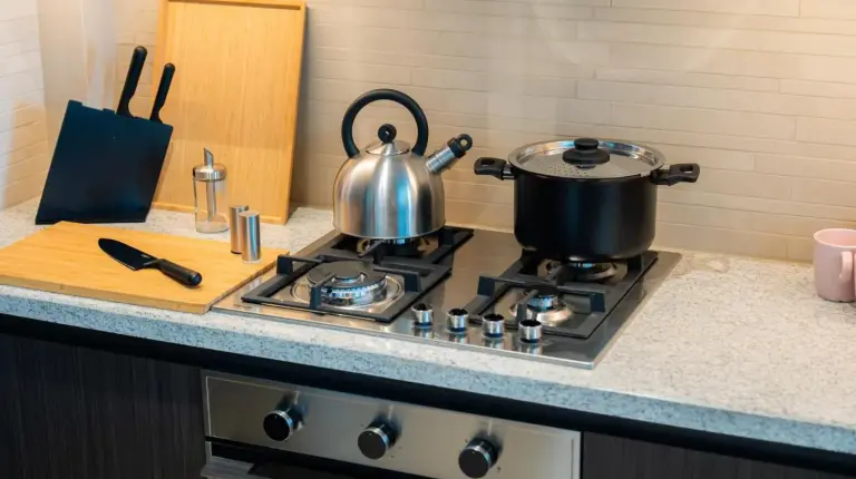 a stove top with two pots and pans on it at Elite Escape Holiday Home - 2 BHK Getaway with Burj Khalifa View and Dubai Mall Access - 1507 in Dubai