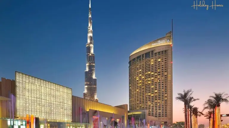 a rendering of a large building with a tall tower at Emaar Fashion Avenue - Formerly Address Dubai Mall Four Apple in Dubai