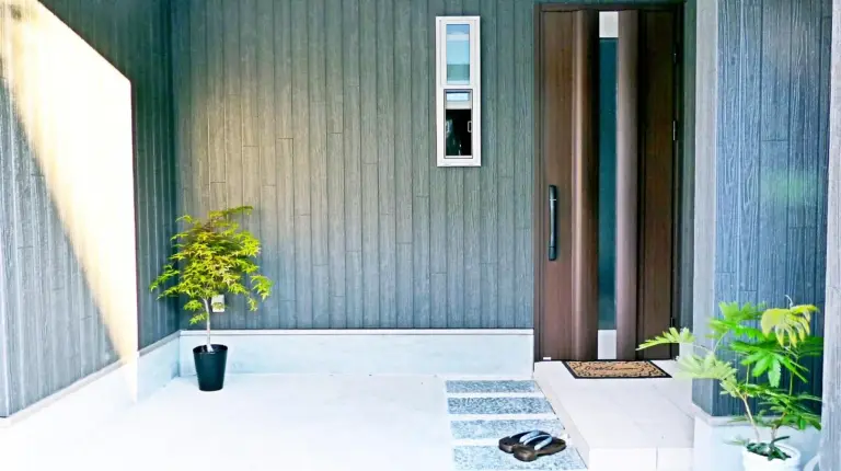 a front door of a house with potted plants at EnSe Kiyomizu Villa in Kyoto