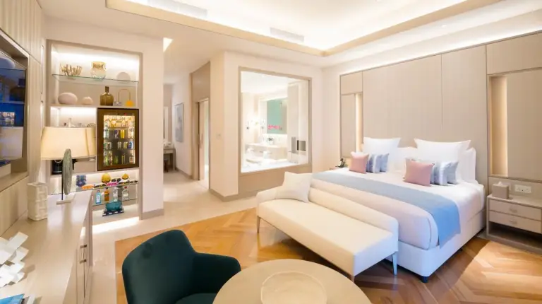 a living room with a view of the city at night at FIVE LUXE in Dubai