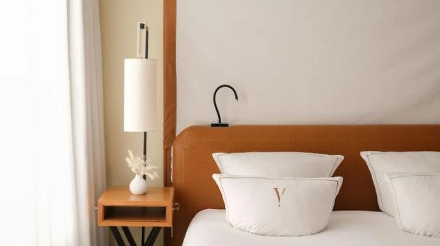a hotel room with a desk and a chair at Five Seas by Inwood Hotels in Cannes
