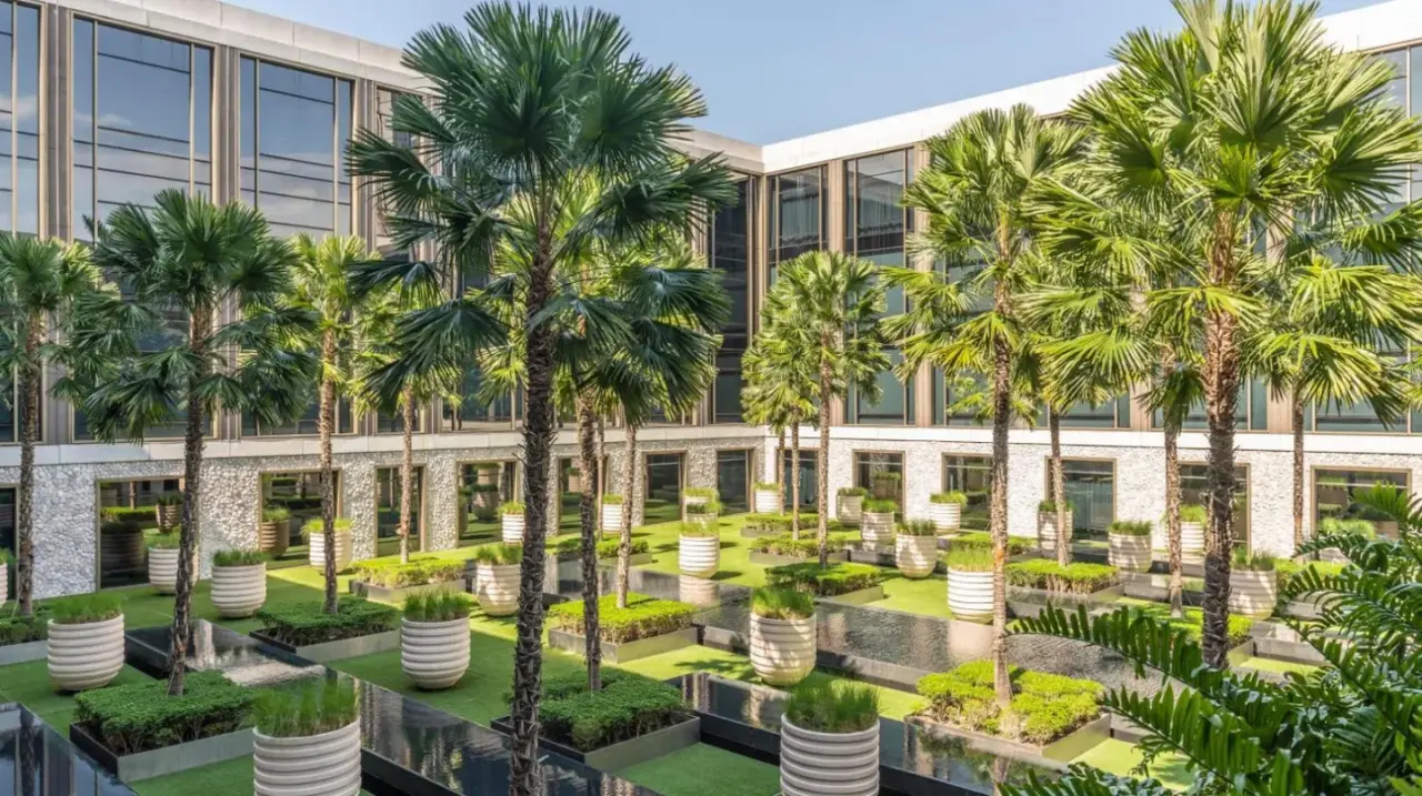 una representación artística del exterior de un edificio con palmeras en Four Seasons Hotel Bangkok at Chao Phraya River en Bangkok
