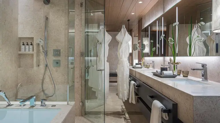 a hotel room with two beds and a large window at Four Seasons Hotel Osaka in Osaka