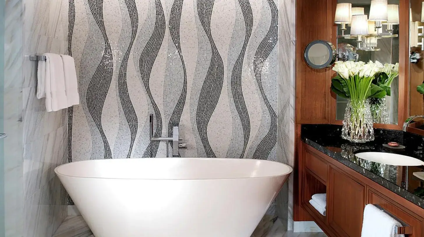 a bathroom with a white tub and a sink at Four Seasons Resort Dubai at Jumeirah Beach in Dubai