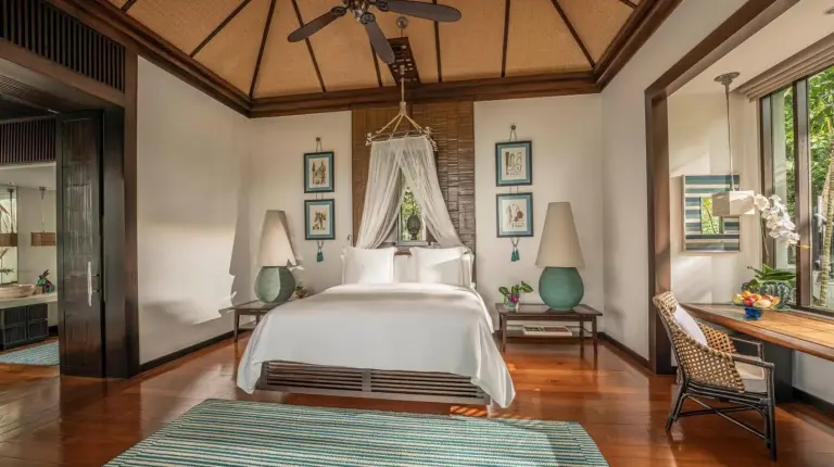 a bedroom with a bed and a ceiling fan at Four Seasons Resort Koh Samui in Mae Nam