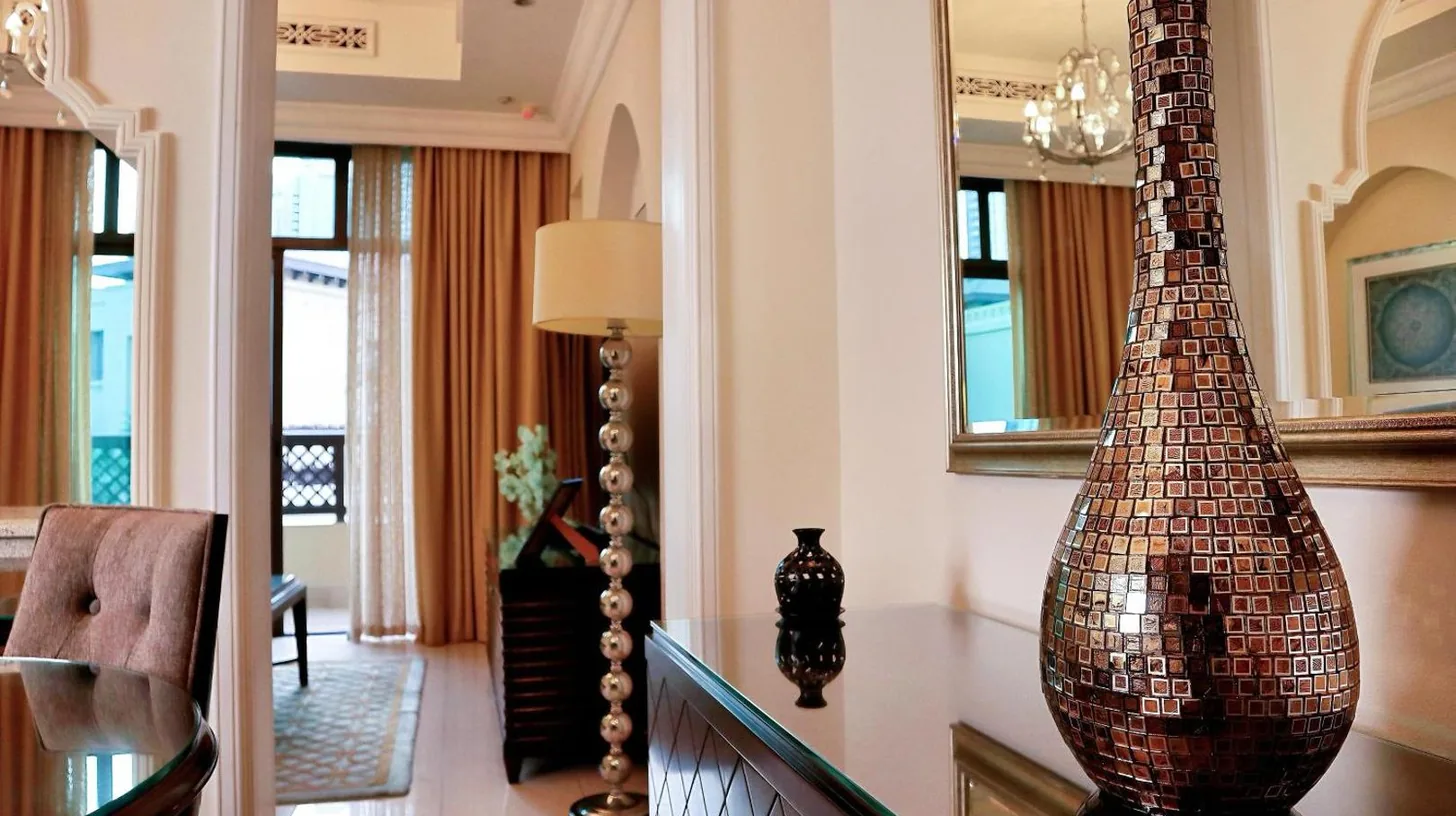 a vase sitting on a table in a living room at Full View Burj Khalifa and Fountains -Souk Al Bahar- Dream View holiday Home Rental in Dubai