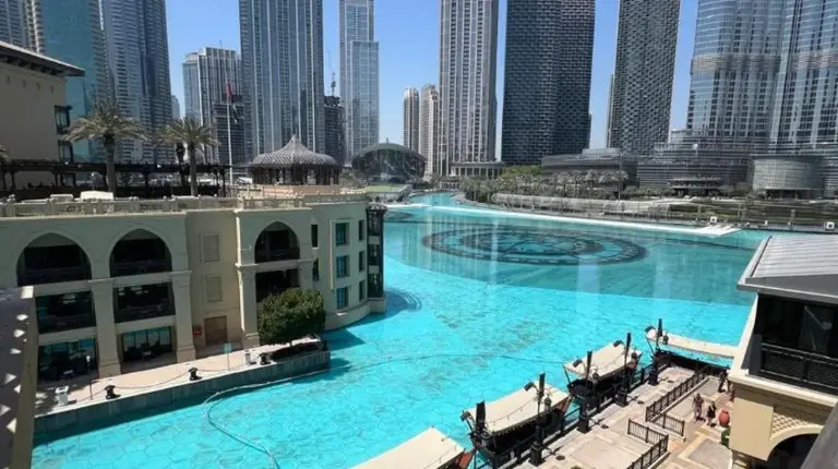 a water fountain in the middle of a city at Full View Burj Khalifa and Fountains -Souk Al Bahar- Dream View holiday Home Rental in Dubai