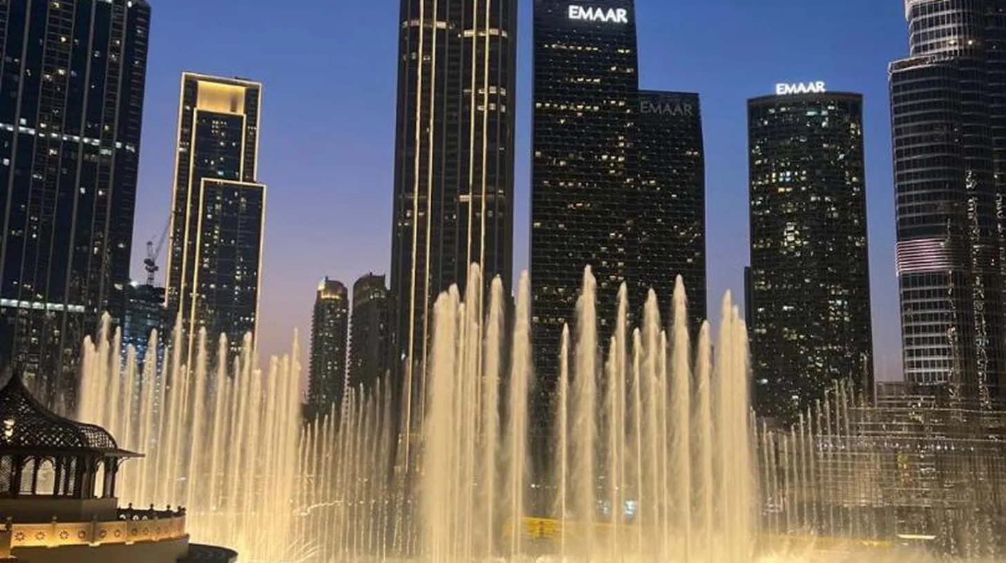a pillow on top of a bed in a hotel room at Full View Burj Khalifa and Fountains -Souk Al Bahar- Dream View holiday Home Rental in Dubai