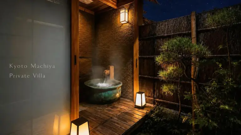 a bathroom with a tub on a deck with lights at Futaai Kyoto Machiya Private Villa in Kyoto