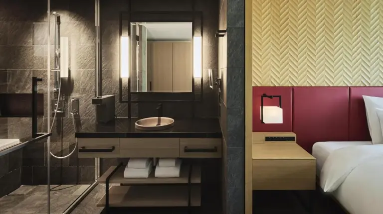 a bathroom with a sink and a shower at Garrya Nijo Castle Kyoto in Kyoto
