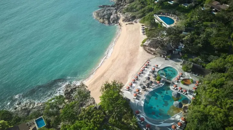 an aerial view of a beach and the ocean at Garrya Tongsai Bay Samui in Choeng Mon Beach