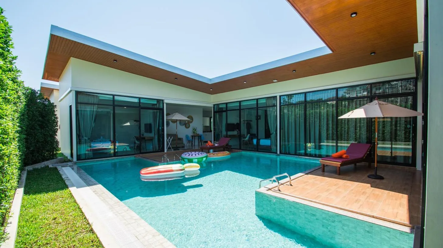 an indoor swimming pool in a house at Good Night Pool Villa Phuket in Phuket Town