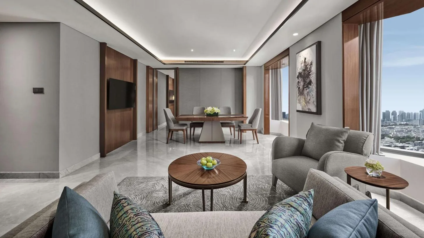 a living room with a couch and a table at Grand Hyatt Jakarta in Jakarta