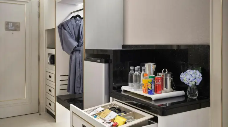 a kitchen with a counter with an open drawer at Grande Centre Point Surawong Bangkok in Bangkok