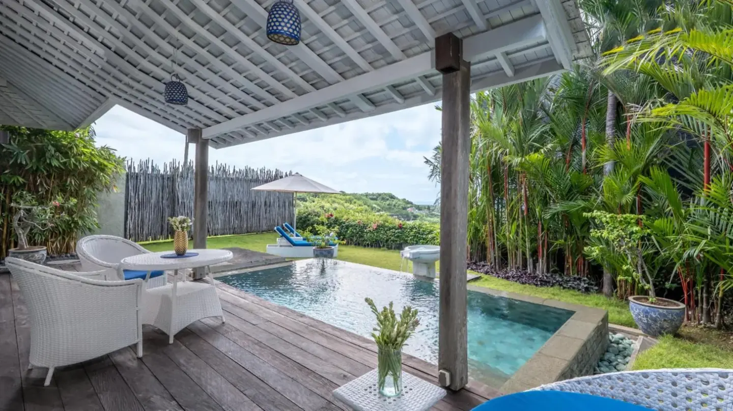 a patio with a swimming pool and a pergola at Hidden Hills Villas - Small Luxury Hotels of The World in Uluwatu