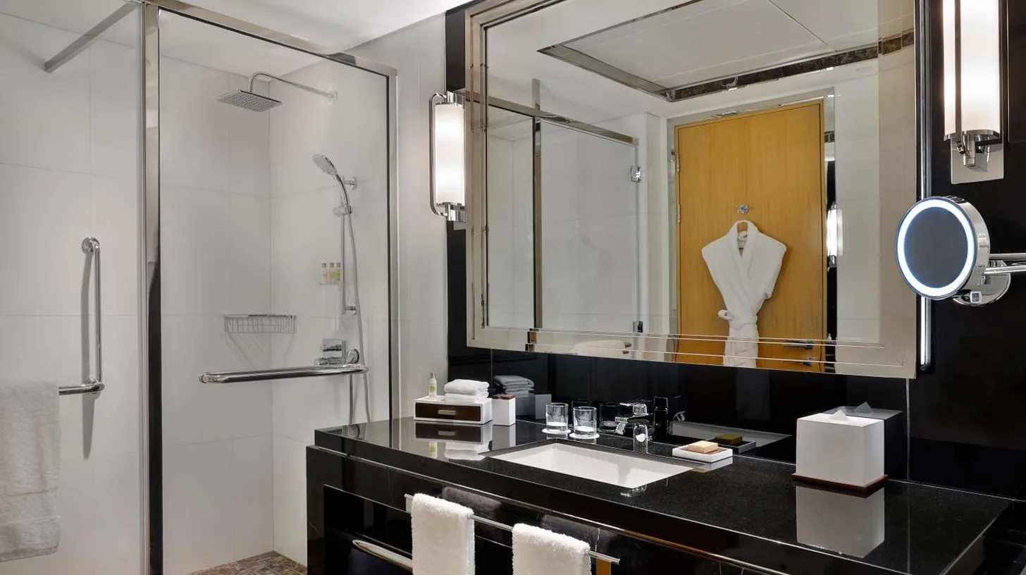 a bathroom with a sink and a mirror at Hilton Dubai Palm Jumeirah in Dubai