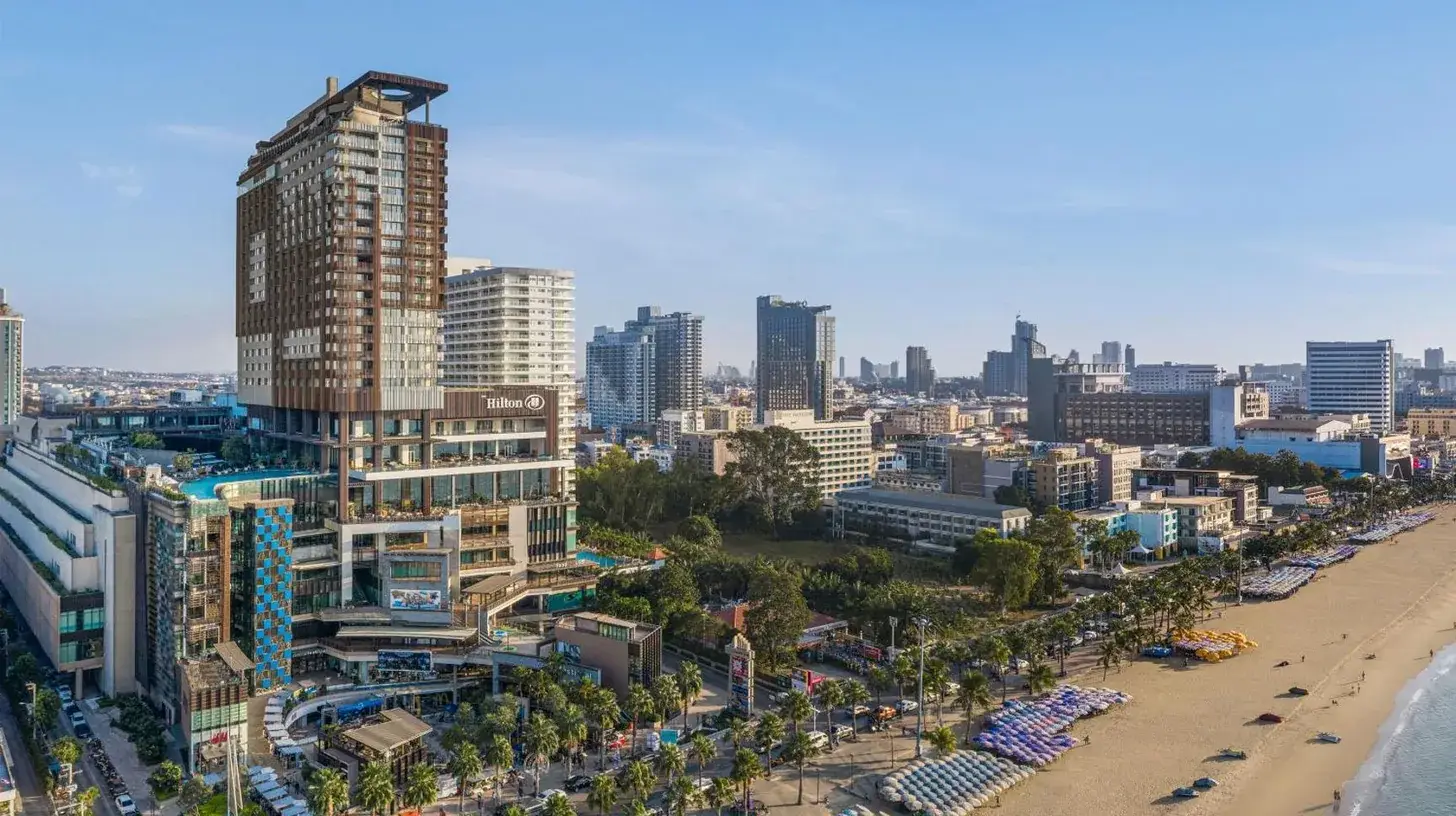 a view of a city with a beach and buildings at Hilton Pattaya in Pattaya Central