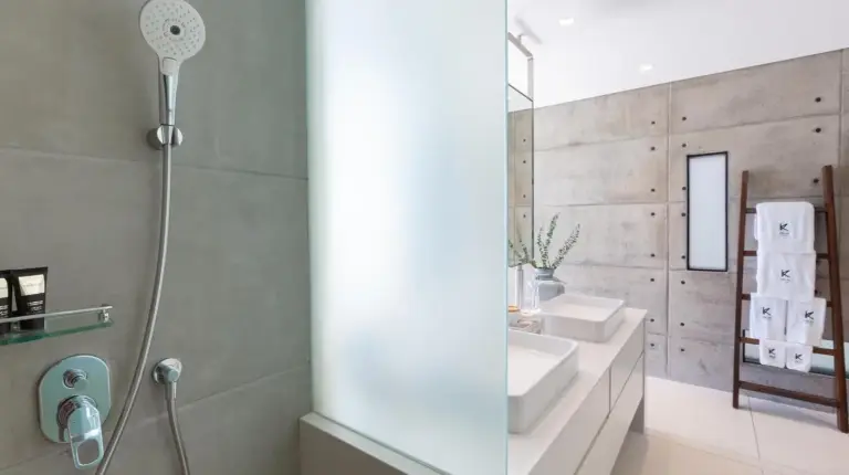 a bathroom with a shower and a sink at Kerem Luxury Beachfront Villas in Choeng Mon Beach