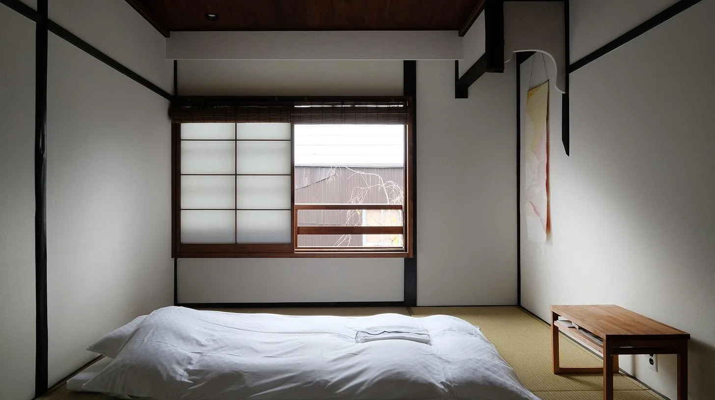 a kitchen with a sink and a counter top at Casa OGUMO in Kyoto