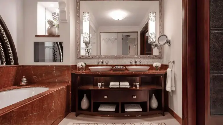 a bathroom with two sinks and a tub and a mirror at One&Only Royal Mirage Resort Dubai in Dubai
