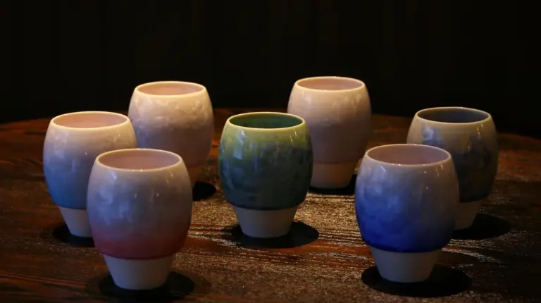 a group of nine votive candles sitting on a table at THE JUNEI HOTEL Kyoto Imperial Palace West in Kyoto