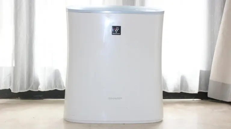 a white refrigerator sitting on the floor in a room at The Buah Bali Villas in Seminyak