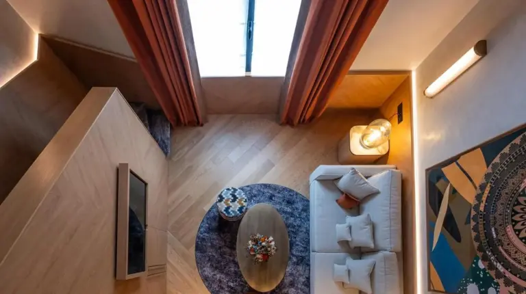 an overhead view of a living room with a table at Hôtel Burdigala by Inwood Hotels in Bordeaux
