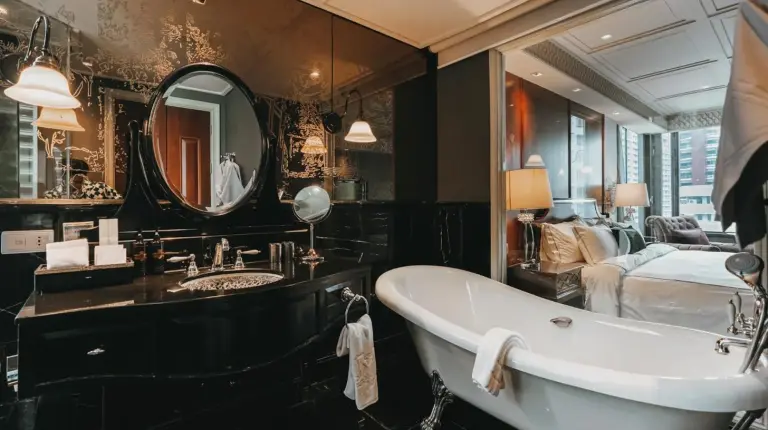 a hotel room with two beds and a desk at Hotel Muse Bangkok
