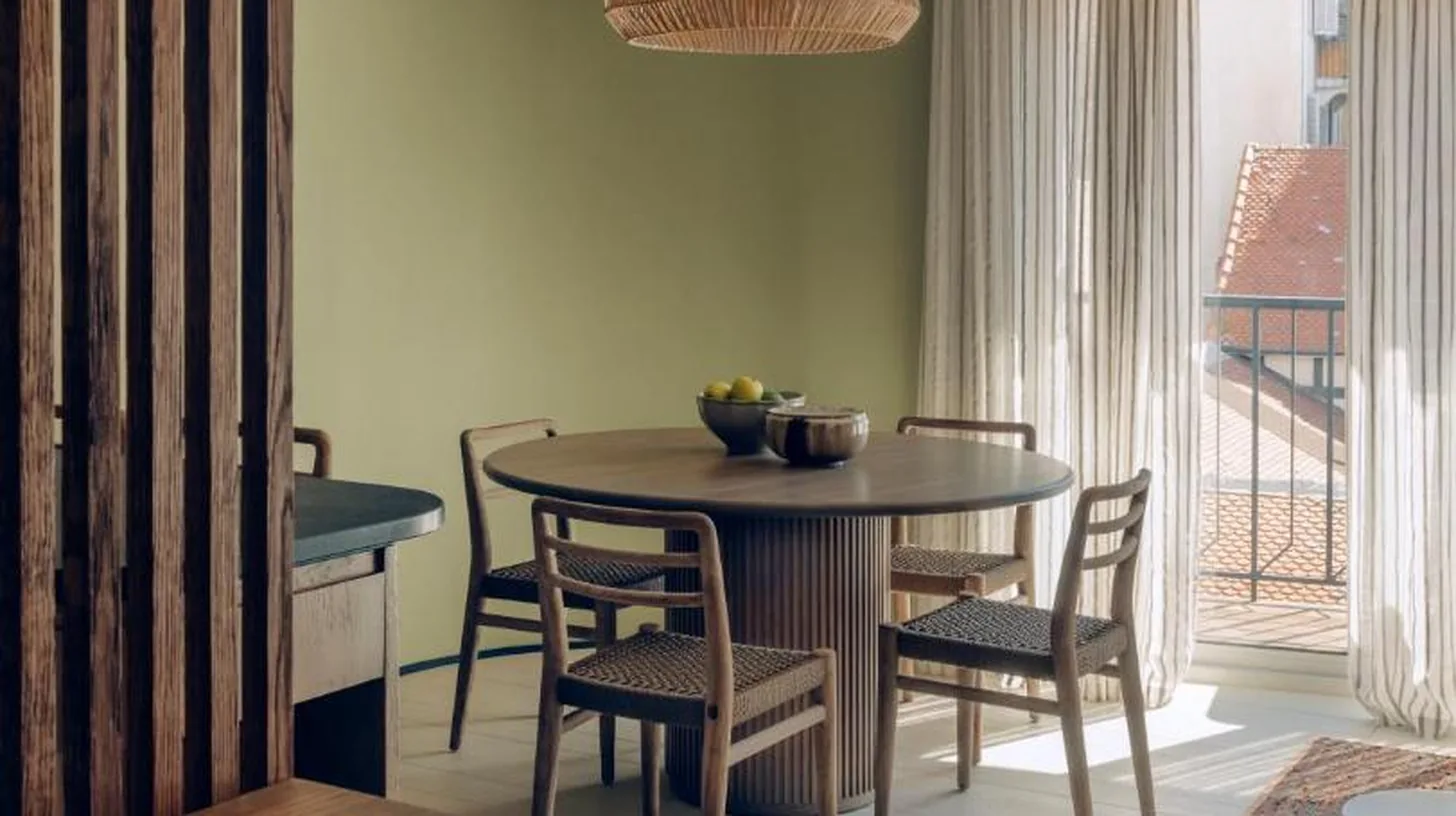 a dining room with a table and chairs at Hôtel & Spa Belle Plage in Cannes