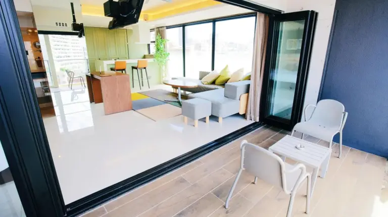 a living room with a view of a living room at HOTEL Viviana in Naha