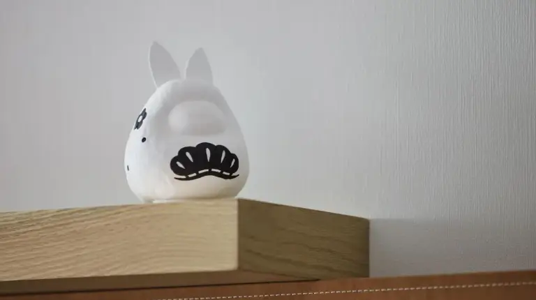 a white egg sitting on top of a wooden shelf at Hyatt Centric Kanazawa in Kanazawa